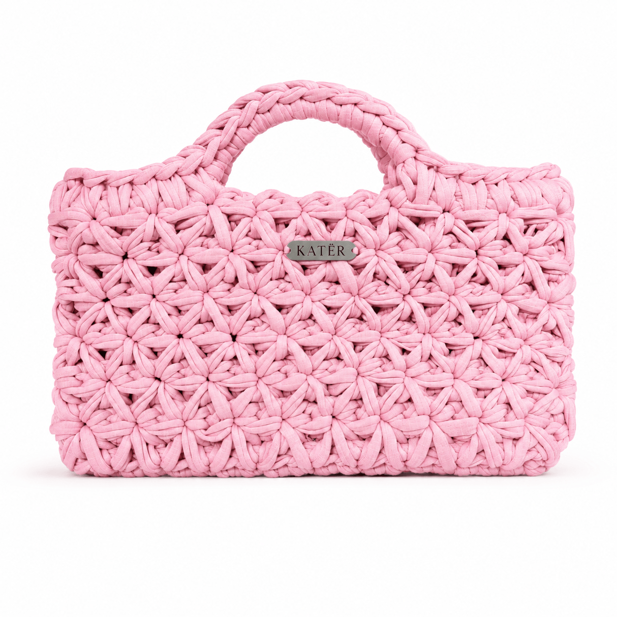 Bubblegum pink crochet handbag with floral stitches and two rounded handles.